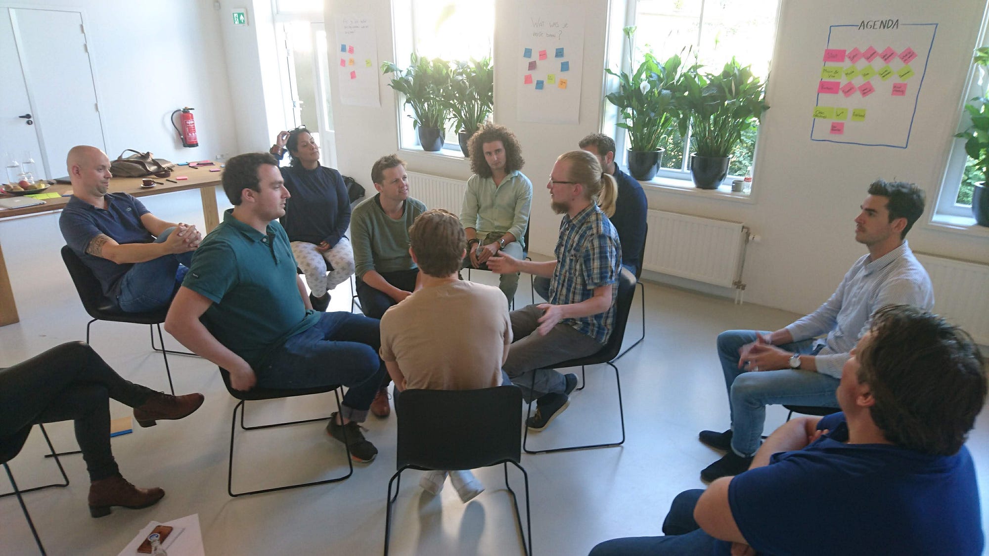 the group practicing the ux fishbowl, led by a facilitator