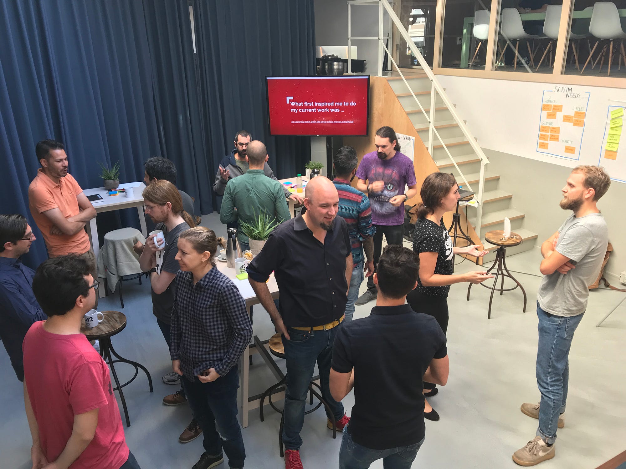 a group of people performing the Mad Tea liberating structure to discuss the topic of what first inspired them to do their current work